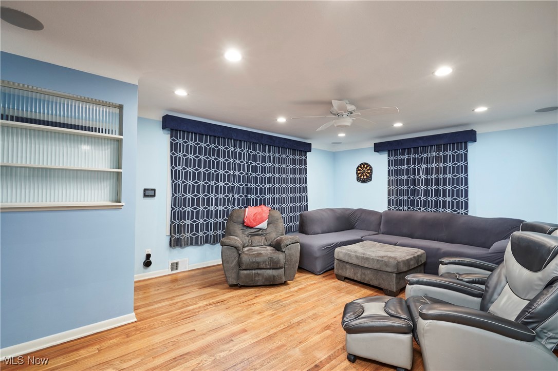 1129 Homestead Road Cleveland, OH 44121 - Photo 11 of 26 Living room with a ceiling fan, recessed lighting, and wood finished floors
