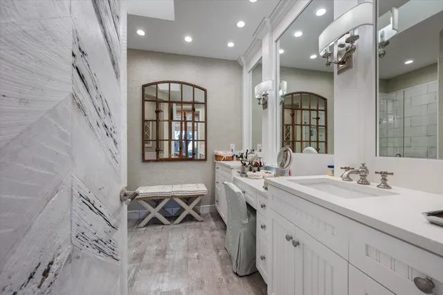 a bathroom with double sink and a mirror