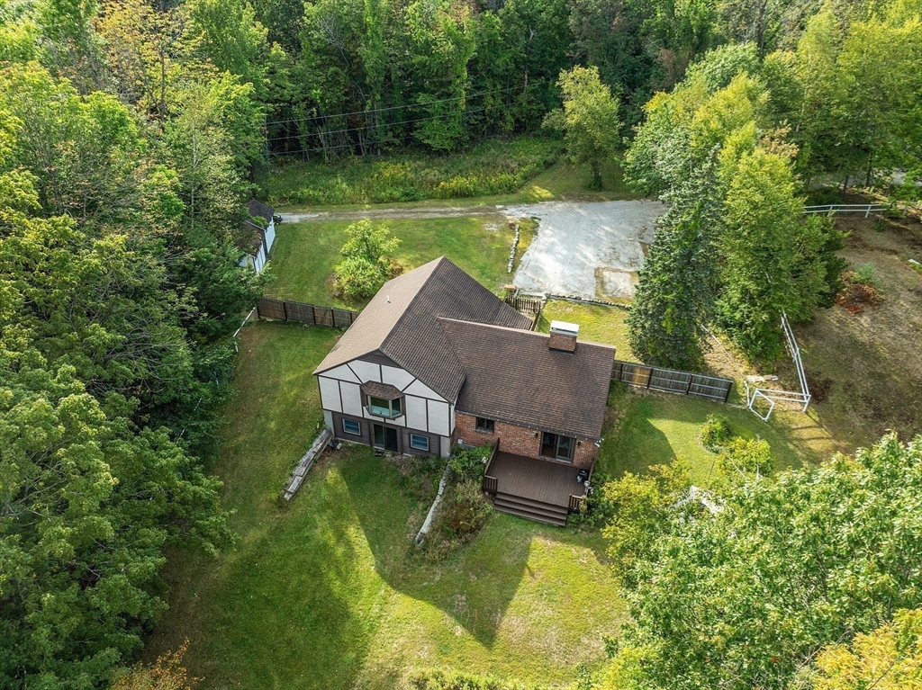 215 Colburn Road Temple, NH 03084 - Photo 4 of 40 an aerial view of a house with swimming pool lake view and mountain view