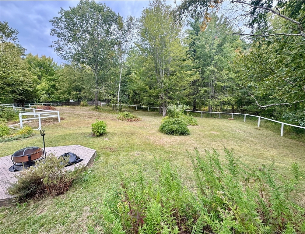 215 Colburn Road Temple, NH 03084 - Photo 5 of 40 a view of a swimming pool with a patio and a yard