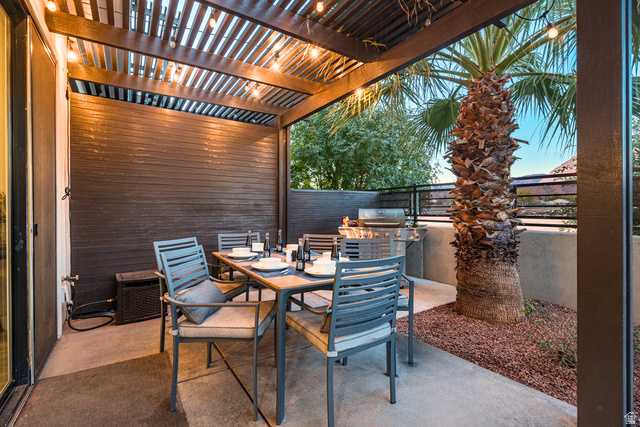 2600 Ocotillo Way, Unit 31 Santa Clara, UT 84765 - Photo 37 of 73 Covered patio featuring a wood slat pergola, string lighting, and concrete flooring