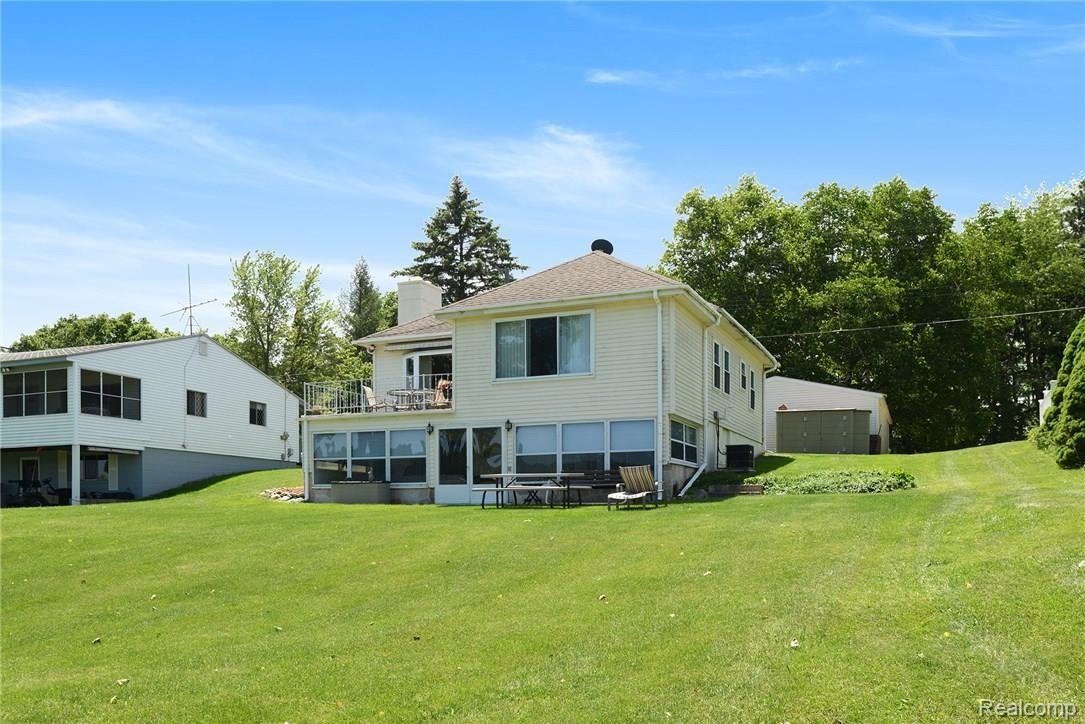 2937 Rubbins Road Howell, MI 48843 - Photo 4 of 27 another view of rear of house from yard.jpg