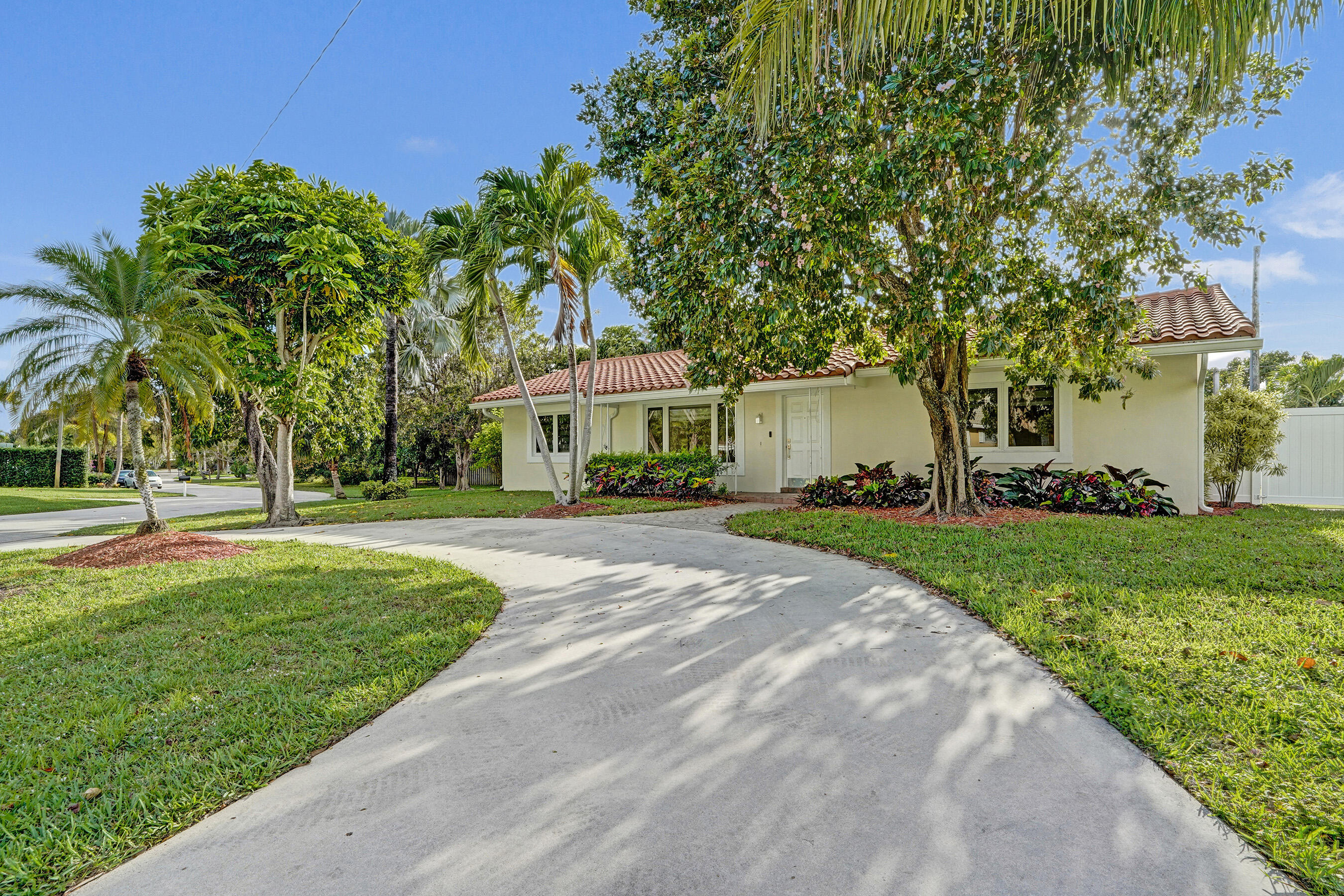 3779 Northwest 4th Court Boca Raton, FL 33431 - Photo 1 of 20 a front view of a house with a yard