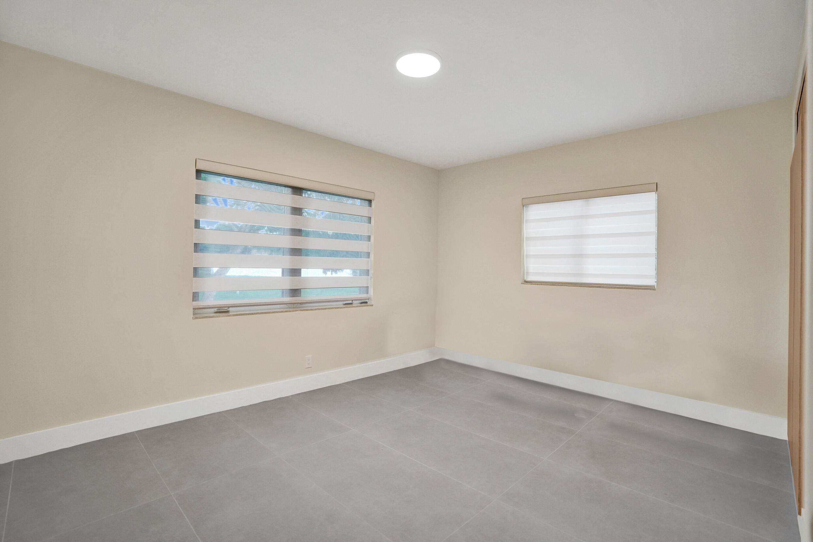 3779 Northwest 4th Court Boca Raton, FL 33431 - Photo 11 of 20 an empty room with windows and closet