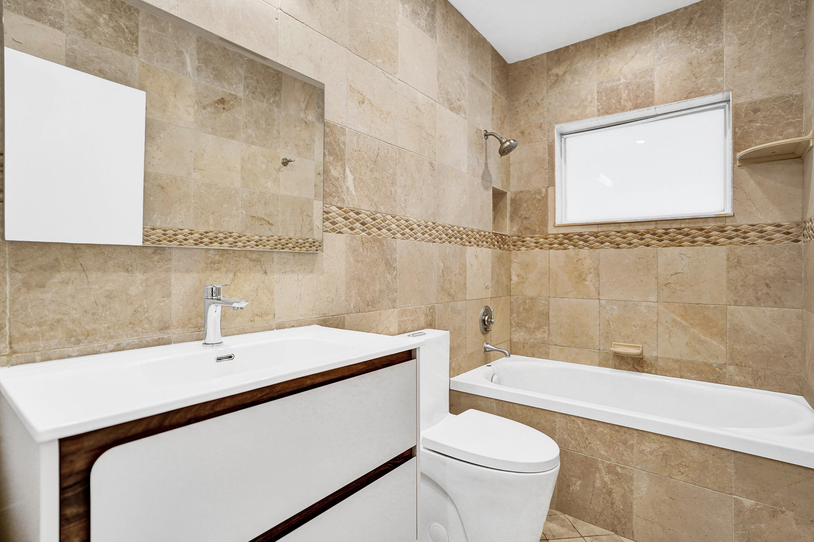 3779 Northwest 4th Court Boca Raton, FL 33431 - Photo 13 of 20 a bathroom with a sink a toilet and a bathtub