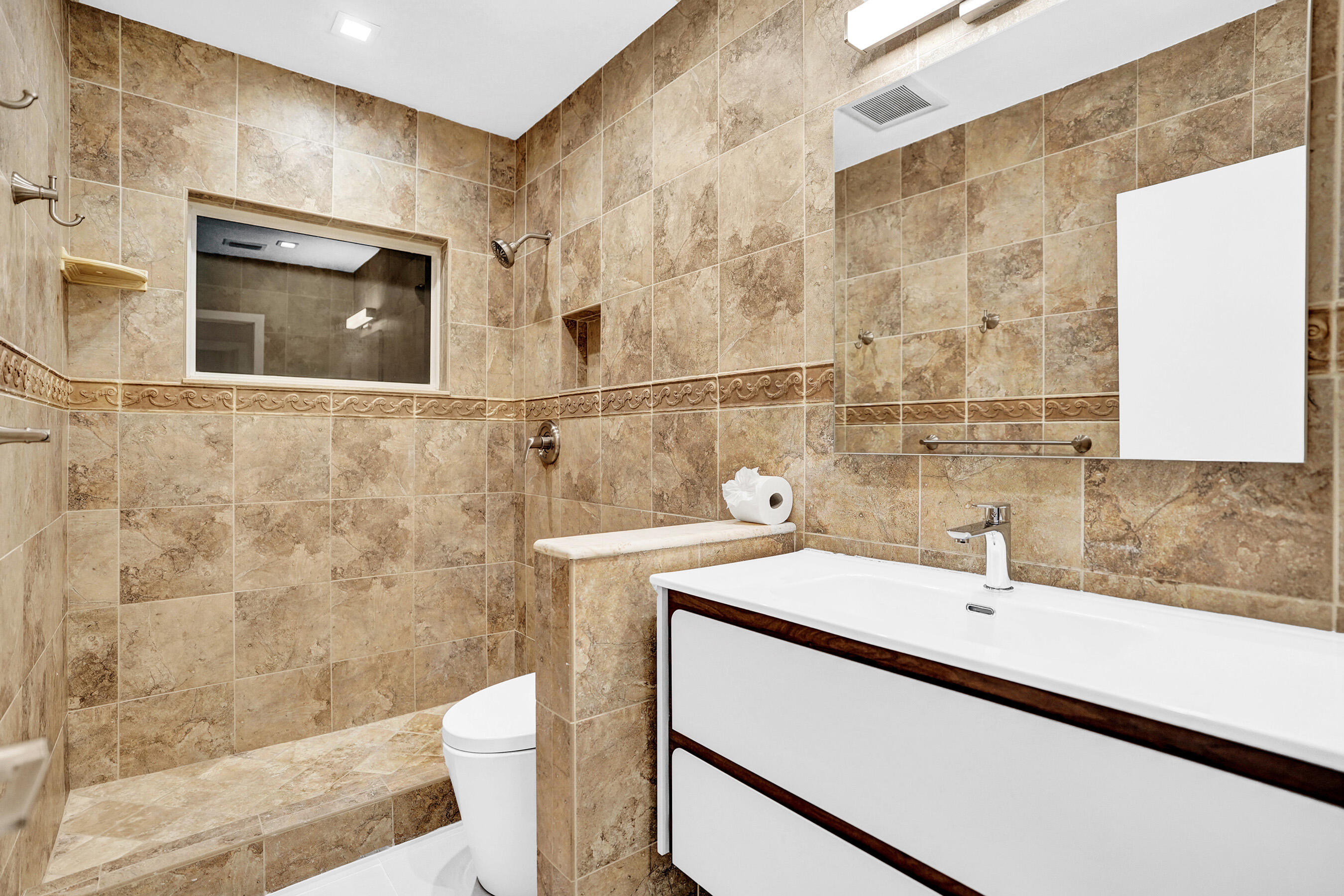 3779 Northwest 4th Court Boca Raton, FL 33431 - Photo 14 of 20 a bathroom with a sink a toilet and shower