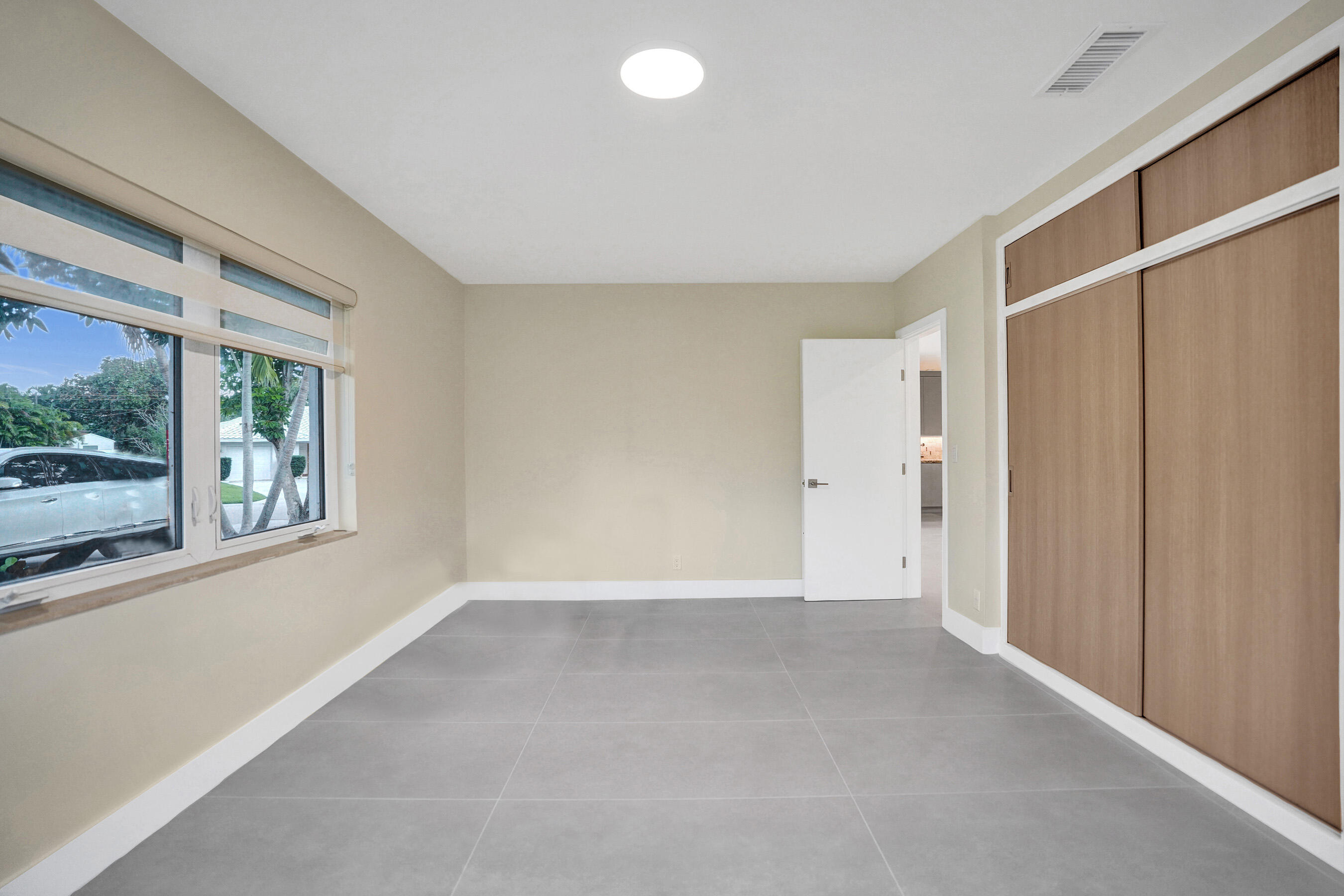 3779 Northwest 4th Court Boca Raton, FL 33431 - Photo 16 of 20 a view of an empty room with a window