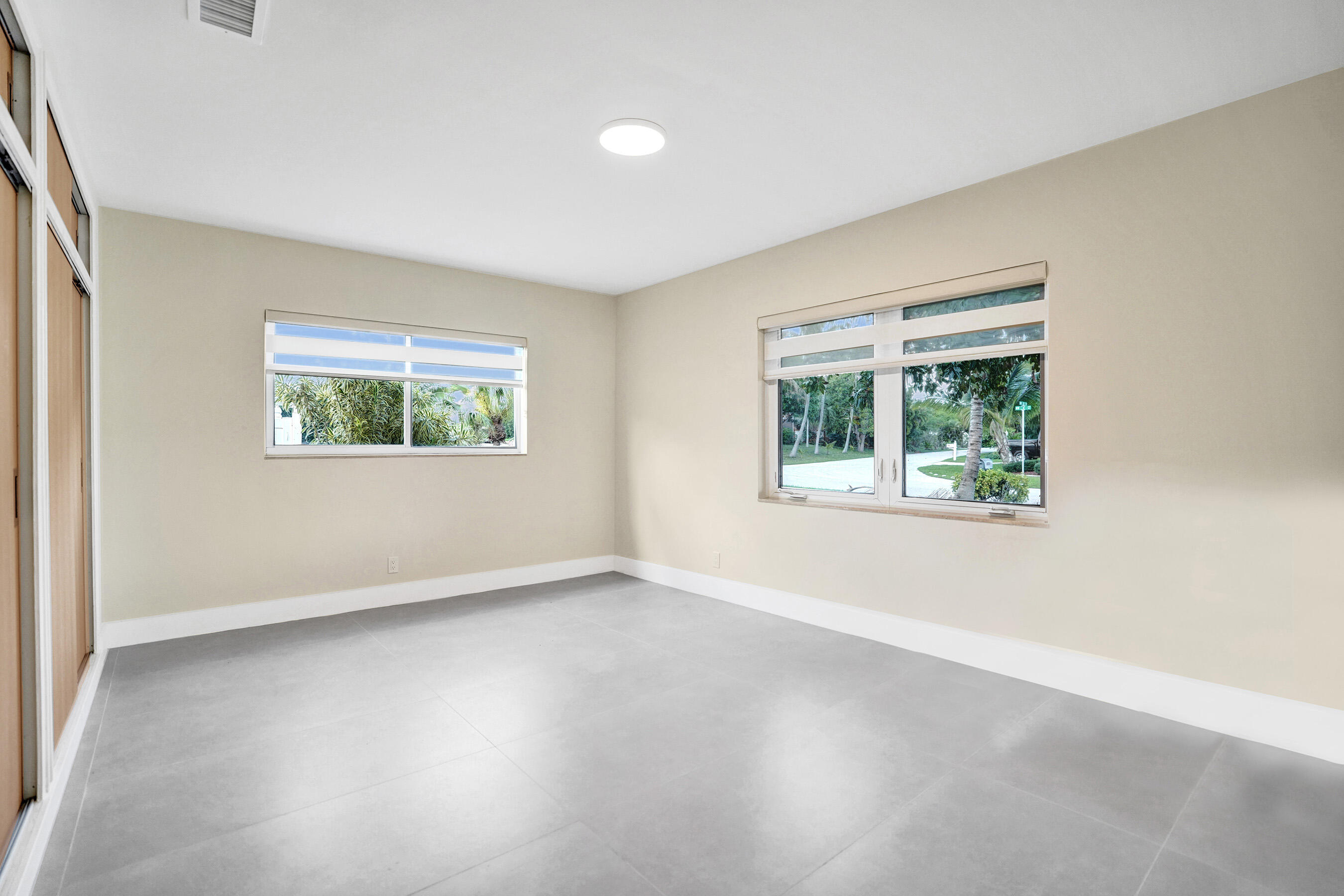 3779 Northwest 4th Court Boca Raton, FL 33431 - Photo 17 of 20 an empty room with windows