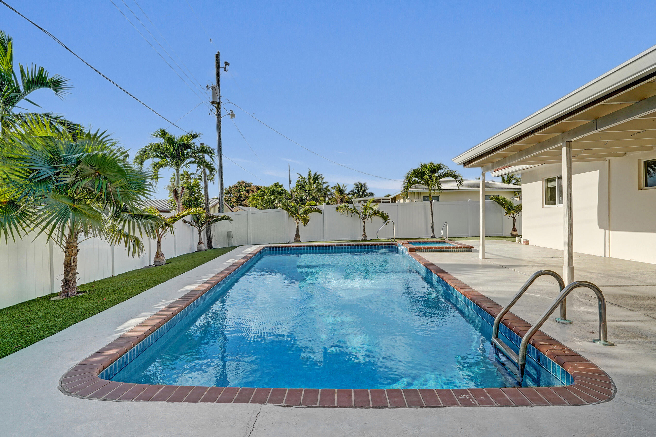 3779 Northwest 4th Court Boca Raton, FL 33431 - Photo 3 of 20 a view of a porch with a table and chairs
