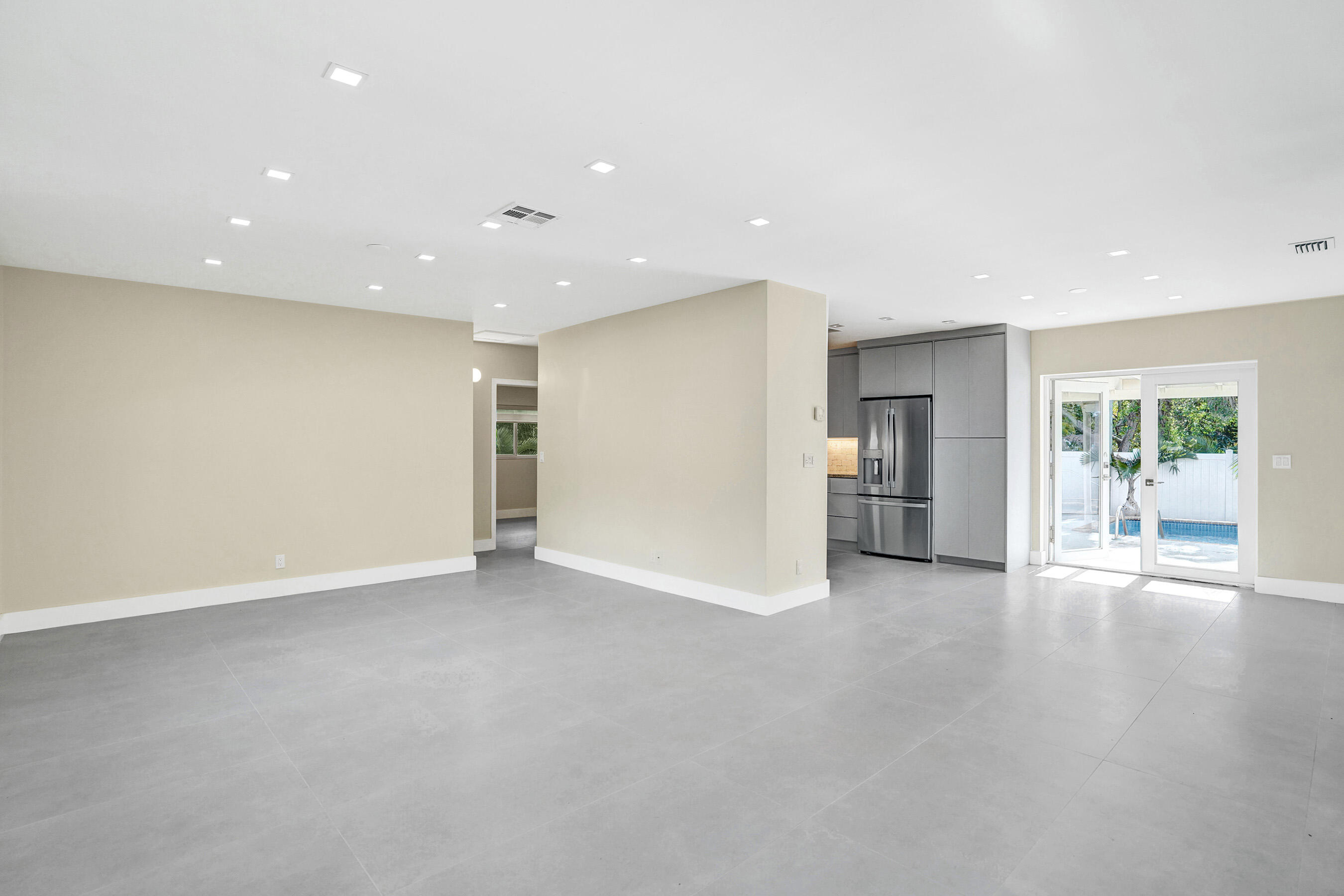 3779 Northwest 4th Court Boca Raton, FL 33431 - Photo 9 of 20 an empty room with window and wooden floor