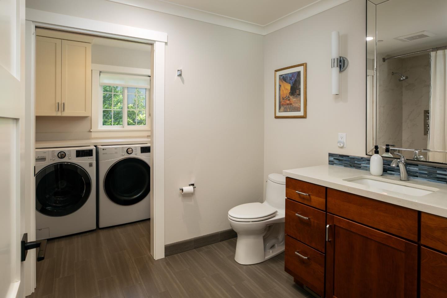 135 Emma Lane Menlo Park, CA 94025 - Photo 12 of 16 a bathroom with a toilet sink a mirror and vanity