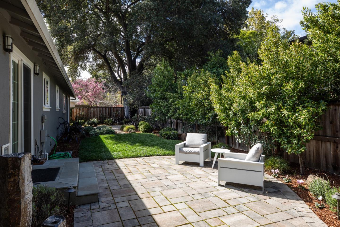 135 Emma Lane Menlo Park, CA 94025 - Photo 14 of 16 a view of a patio with chairs and plants