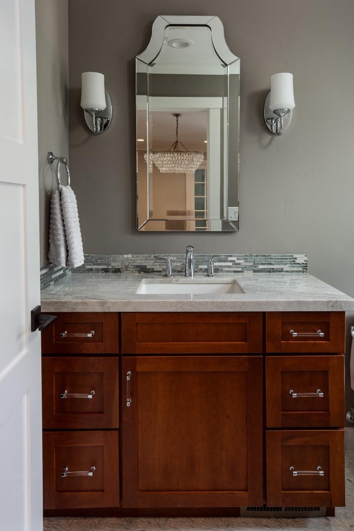 135 Emma Lane Menlo Park, CA 94025 - Photo 7 of 16 a bathroom with a granite countertop sink and a mirror