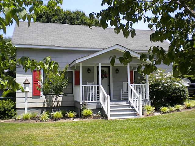 1024 Pagan Road Raleigh, NC 27603 - Photo 1 of 25 a front view of a house with a garden and plants