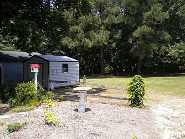 1024 Pagan Road Raleigh, NC 27603 - Photo 25 of 25 a front view of a house with garden