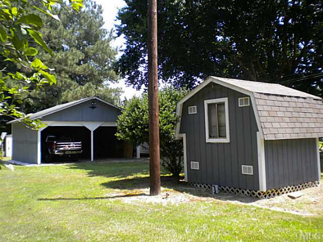 1024 Pagan Road Raleigh, NC 27603 - Photo 3 of 25 a view of a house with a yard and tree