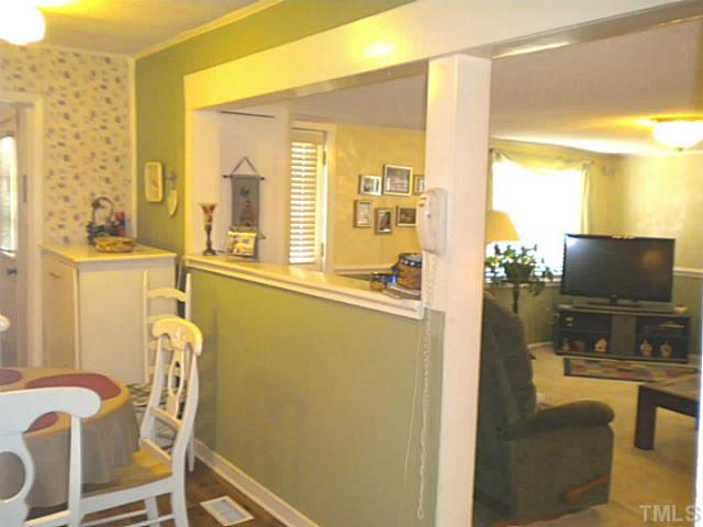 1024 Pagan Road Raleigh, NC 27603 - Photo 8 of 25 a view of a dining room with furniture and a window
