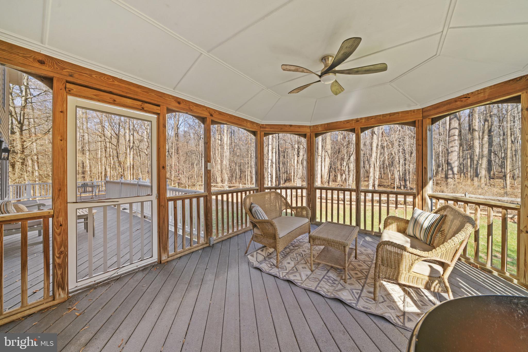 18700 Olney Mill Road Olney, MD 20832 - Photo 13 of 86 a view of a porch with wooden floor