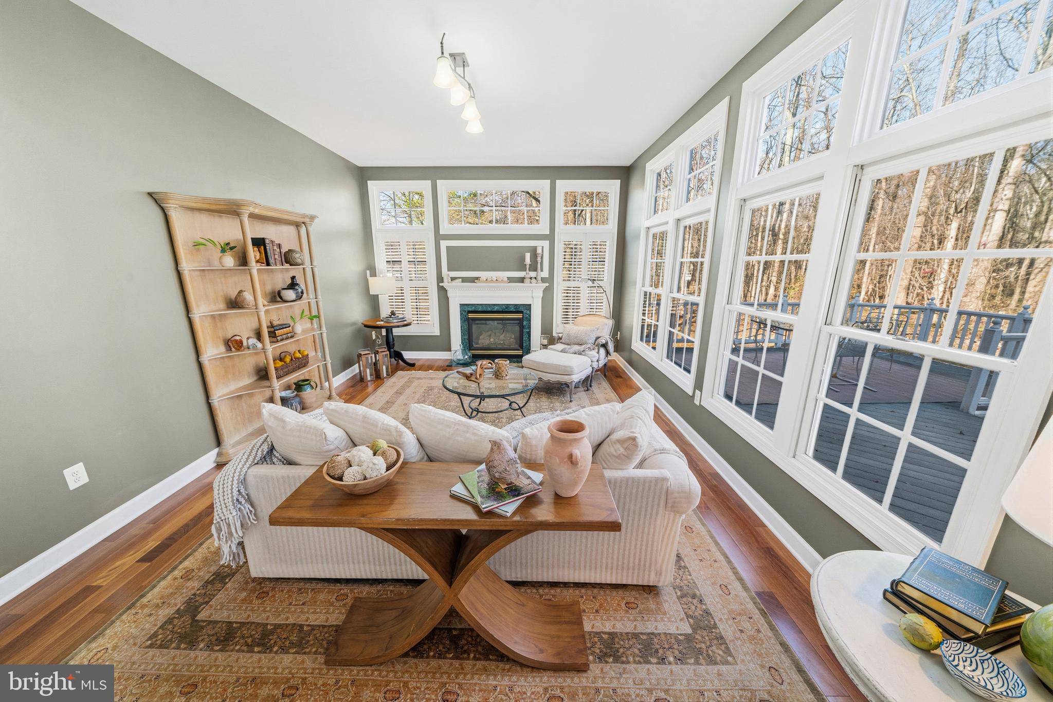 18700 Olney Mill Road Olney, MD 20832 - Photo 24 of 86 a living room with furniture and a floor to ceiling window