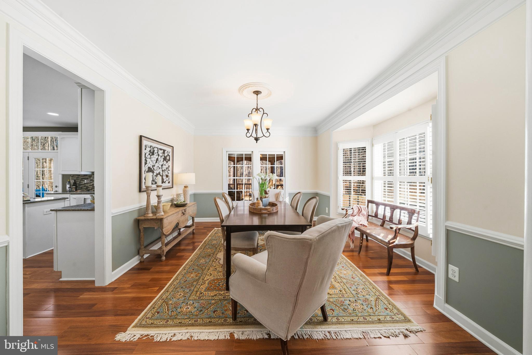 18700 Olney Mill Road Olney, MD 20832 - Photo 32 of 86 a living room with fireplace furniture rug and wooden floor