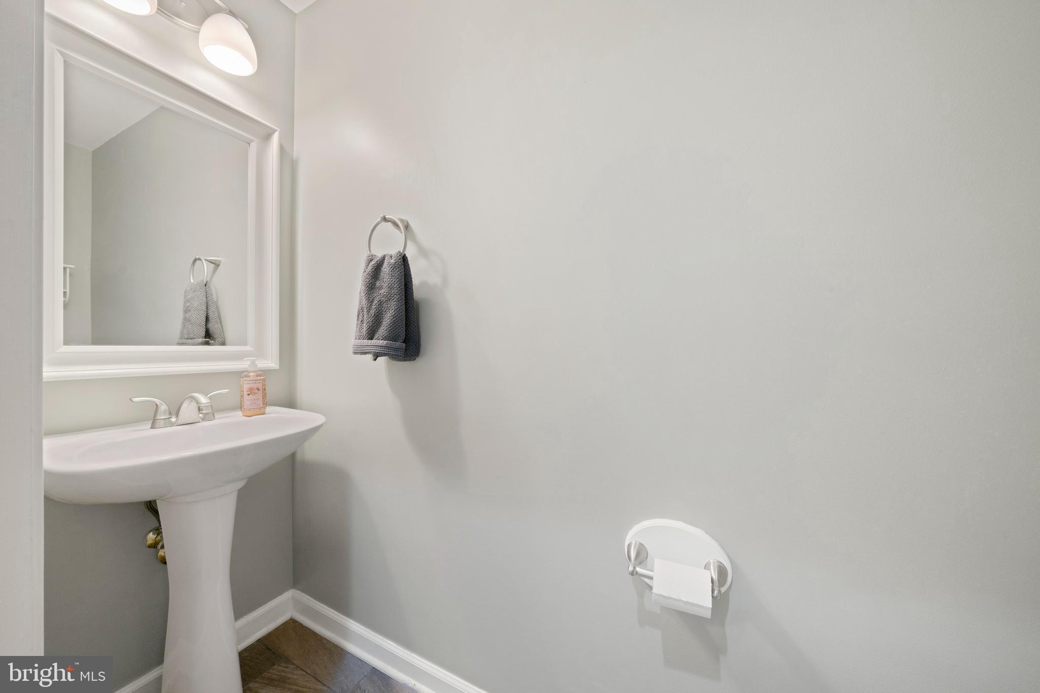 18700 Olney Mill Road Olney, MD 20832 - Photo 40 of 86 a bathroom with a sink a mirror and vanity