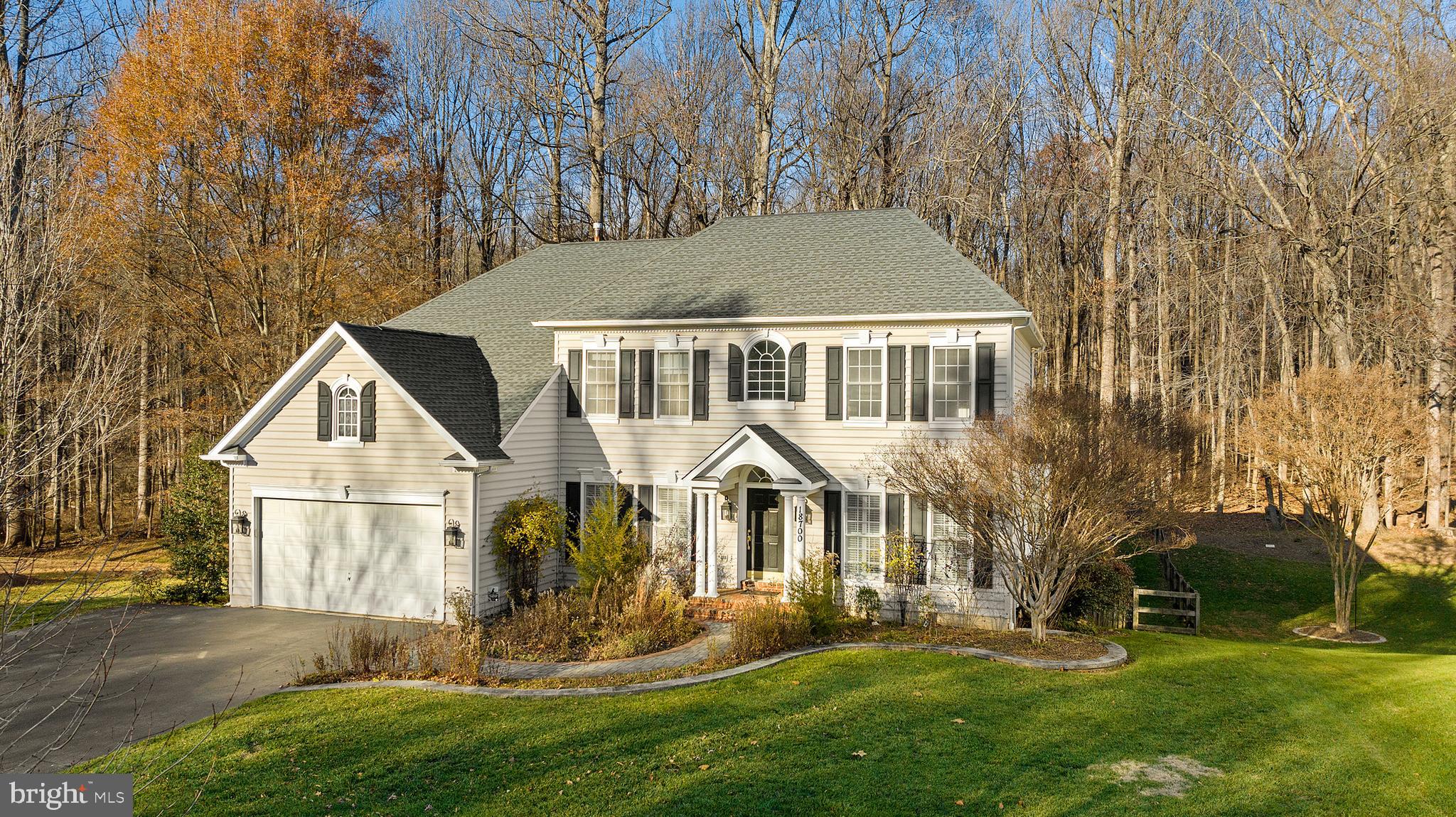 18700 Olney Mill Road Olney, MD 20832 - Photo 5 of 86 a front view of a house with a yard and trees