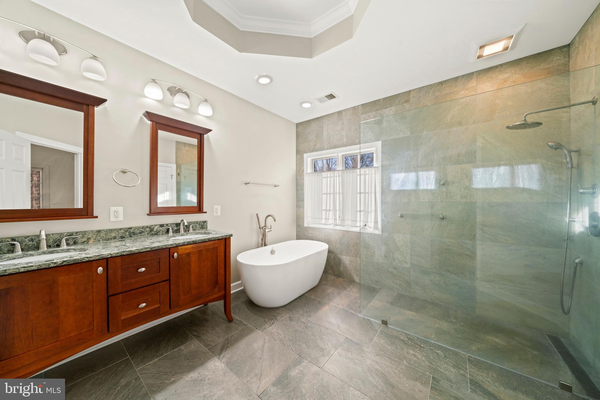 18700 Olney Mill Road Olney, MD 20832 - Photo 51 of 86 a spacious bathroom with a double vanity sink mirror and double