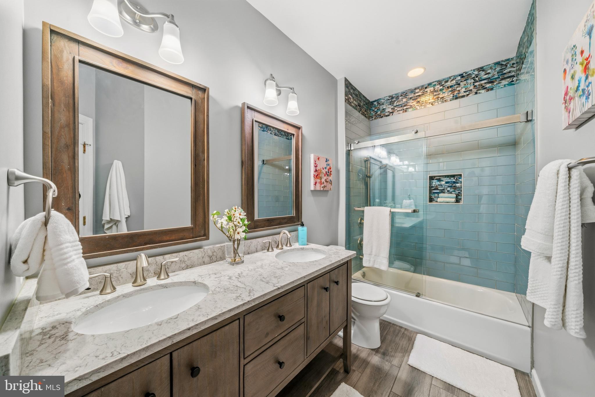 18700 Olney Mill Road Olney, MD 20832 - Photo 59 of 86 Hall bath with custom tile and dual vanity