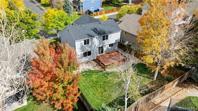 a aerial view of a house with a yard basket ball court and outdoor seating