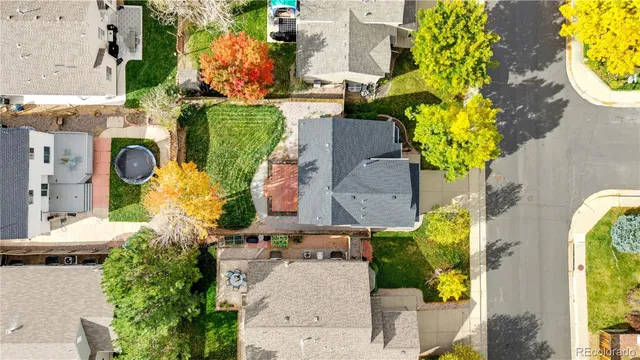 an aerial view of a house with a swimming pool
