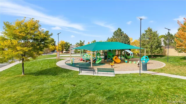 a view of a table and chairs under an umbrella