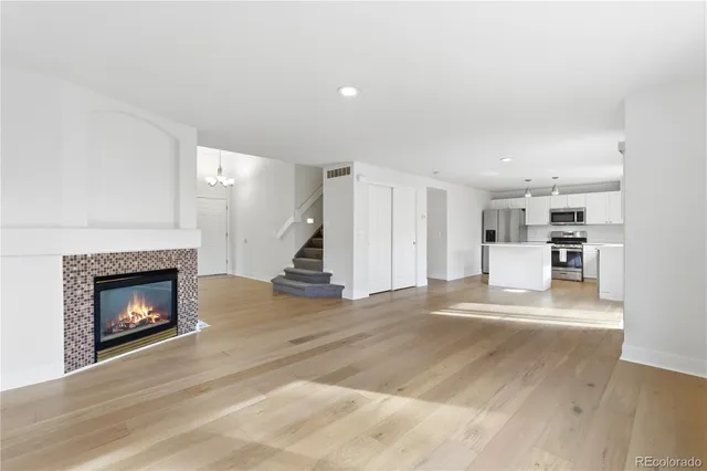 a view of kitchen with furniture and fireplace