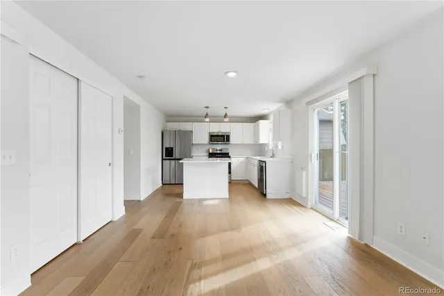 a view of kitchen with wooden floor