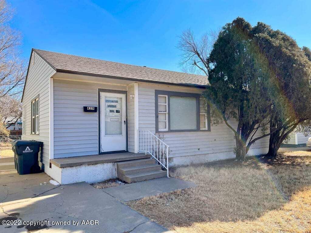 4319 Gables Street Amarillo, TX 79110 - Photo 1 of 15 a front view of a house with a yard