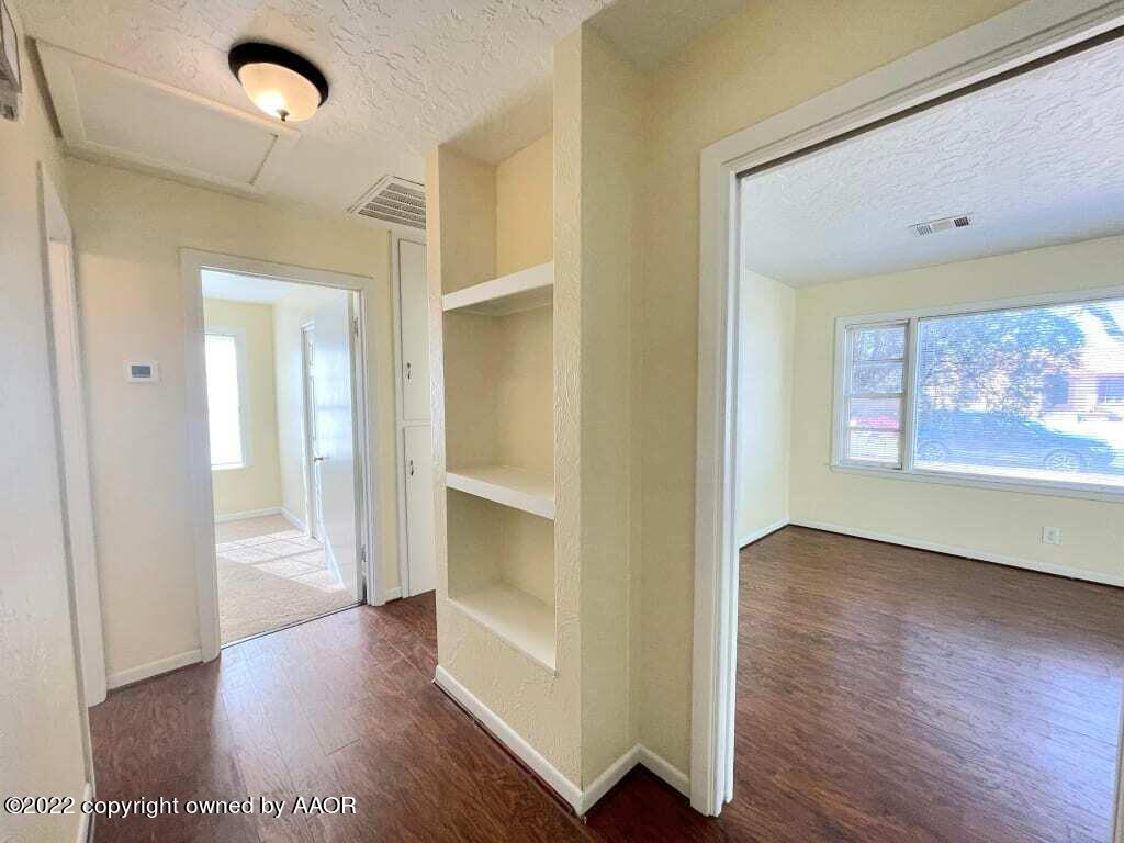 4319 Gables Street Amarillo, TX 79110 - Photo 2 of 15 wooden floor in an empty room