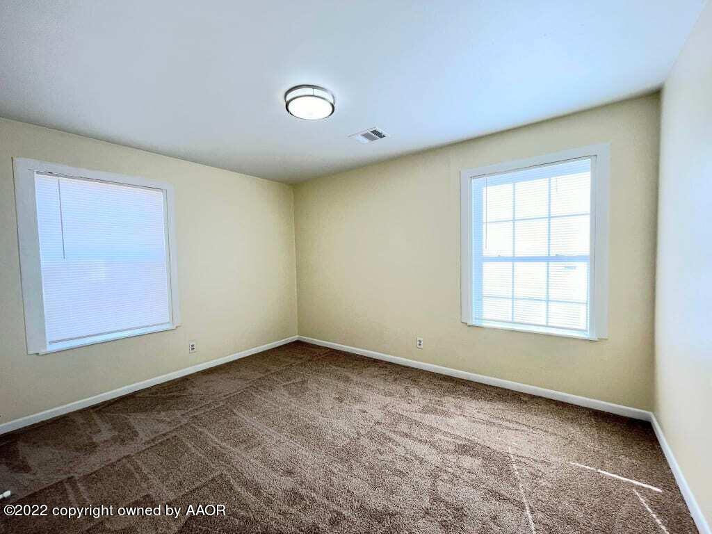 4319 Gables Street Amarillo, TX 79110 - Photo 8 of 15 an empty room with a window