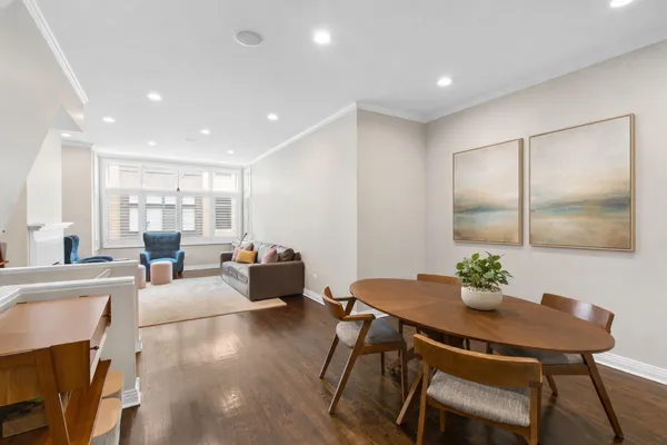 a view of a dining room with furniture window and wooden floor