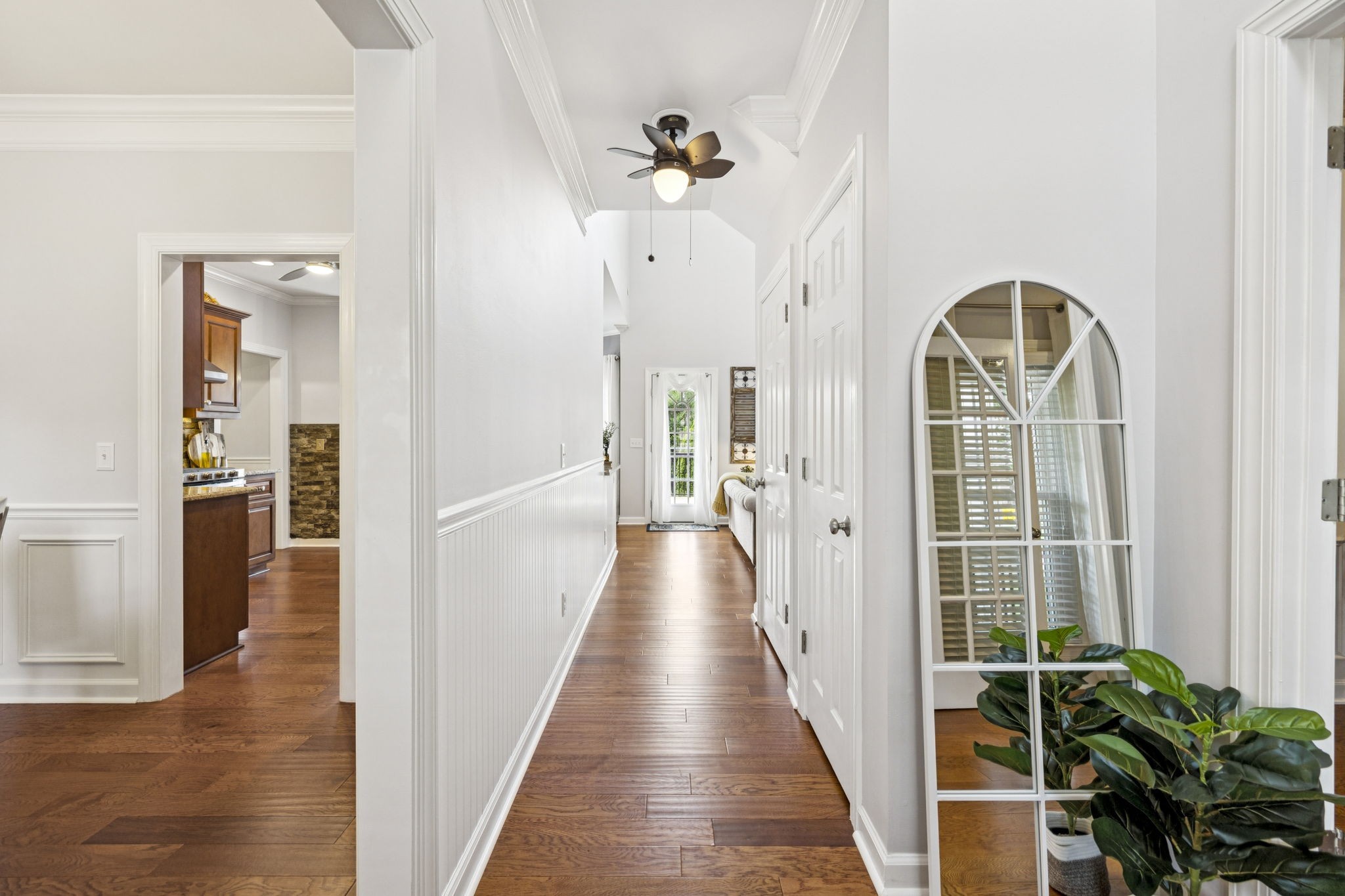 1011 Red Pepper Ridge Spring Hill, TN 37174 - Photo 11 of 76 a view of a hallway with wooden floor and a chandelier
