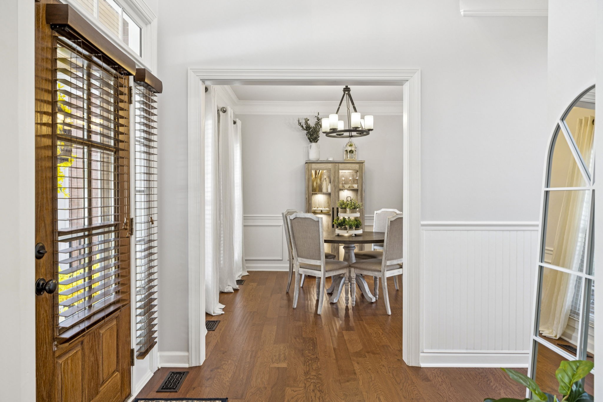 1011 Red Pepper Ridge Spring Hill, TN 37174 - Photo 12 of 76 a dining room with furniture a chandelier and wooden floor