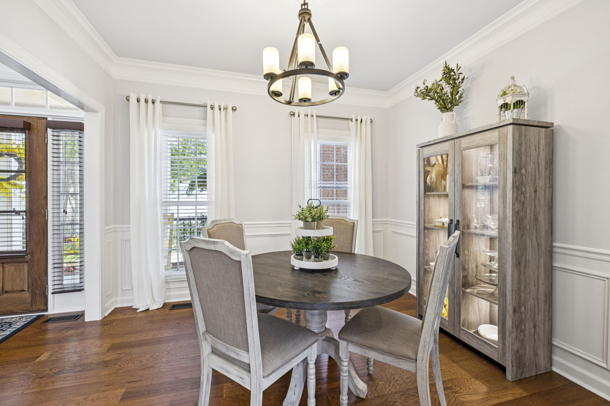 1011 Red Pepper Ridge Spring Hill, TN 37174 - Photo 14 of 76 a dining room with furniture a chandelier and wooden floor