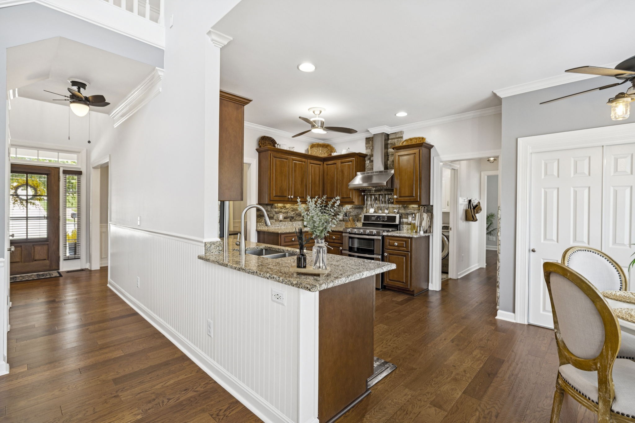 1011 Red Pepper Ridge Spring Hill, TN 37174 - Photo 24 of 76 a view of kitchen center island cabinets and wooden floor