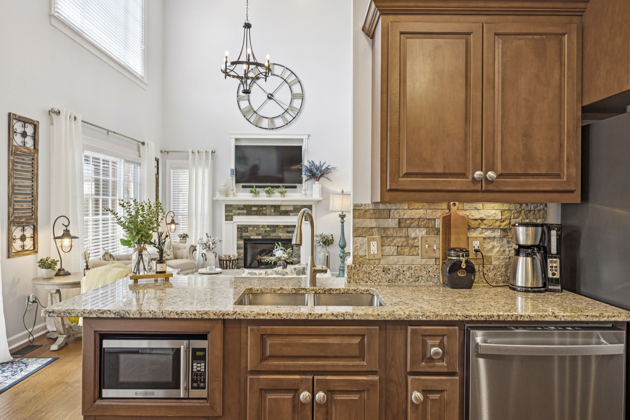 1011 Red Pepper Ridge Spring Hill, TN 37174 - Photo 28 of 76 a kitchen with granite countertop a stove and a sink
