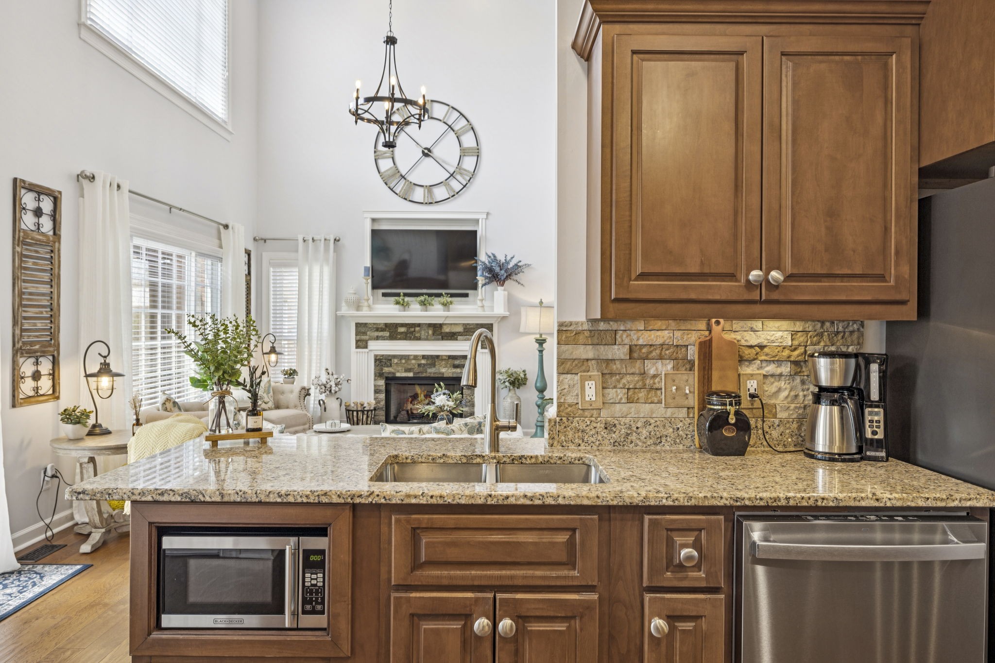 1011 Red Pepper Ridge Spring Hill, TN 37174 - Photo 29 of 76 a kitchen with granite countertop a stove and a sink