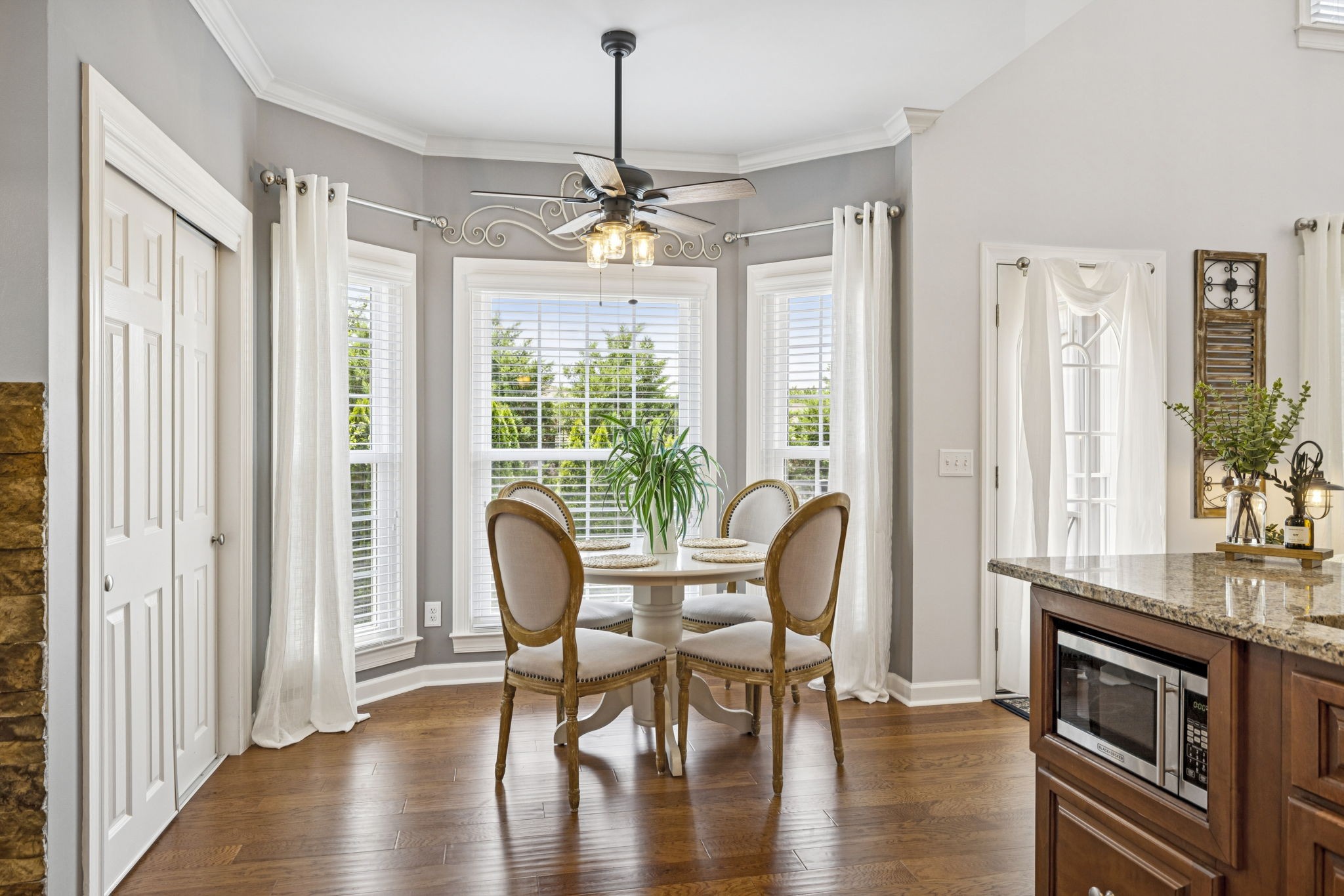 1011 Red Pepper Ridge Spring Hill, TN 37174 - Photo 32 of 76 a view of a dining room with furniture window and wooden floor