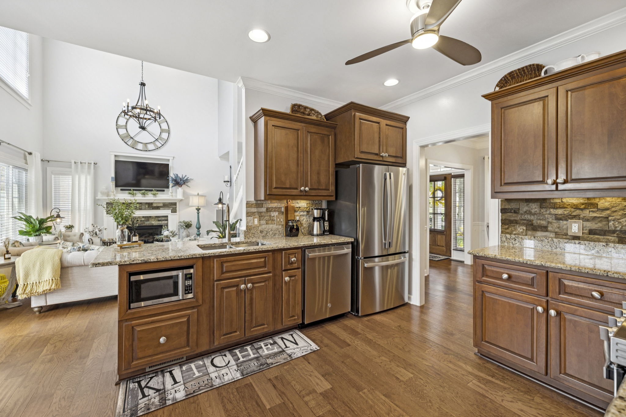 1011 Red Pepper Ridge Spring Hill, TN 37174 - Photo 33 of 76 a kitchen with stainless steel appliances granite countertop a refrigerator a stove top oven a sink and dishwasher