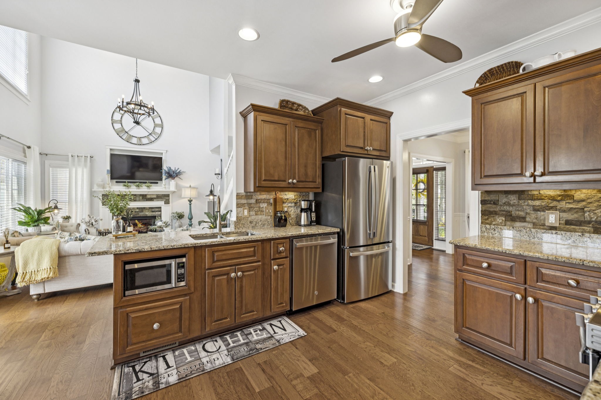 1011 Red Pepper Ridge Spring Hill, TN 37174 - Photo 34 of 76 a kitchen with stainless steel appliances granite countertop a refrigerator a stove top oven a sink and dishwasher