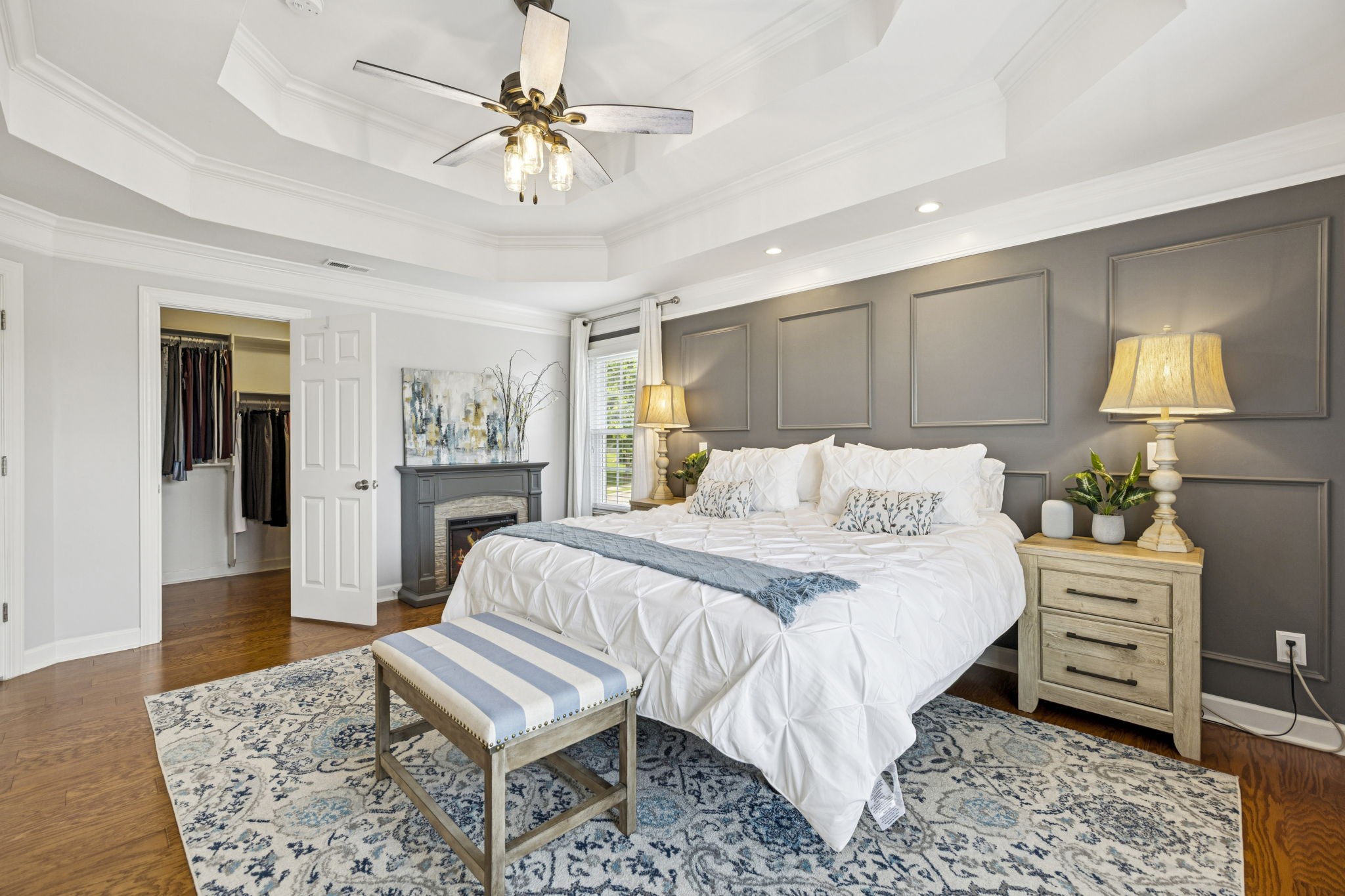 1011 Red Pepper Ridge Spring Hill, TN 37174 - Photo 50 of 76 a bedroom with a bed and a chandelier