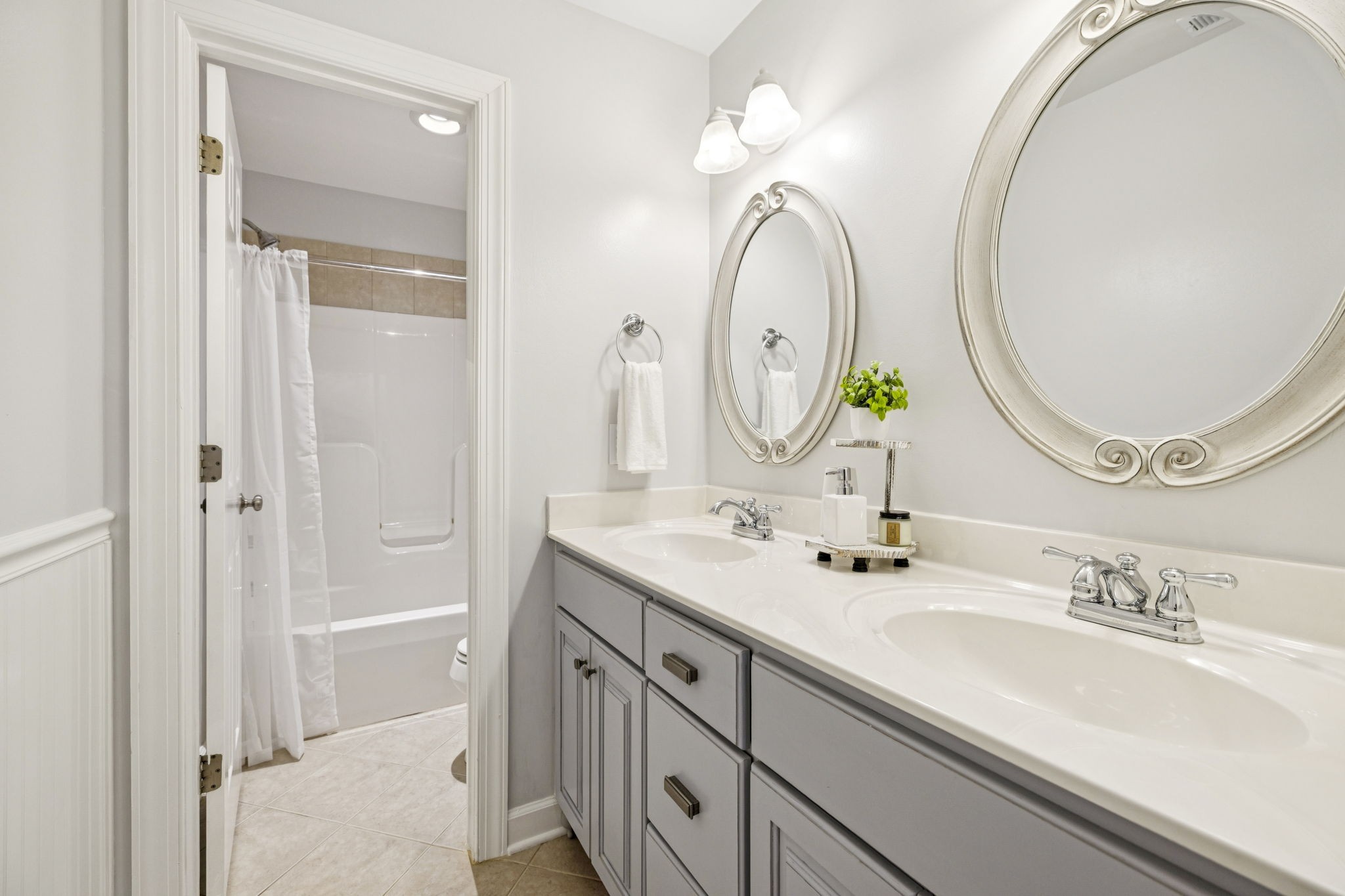 1011 Red Pepper Ridge Spring Hill, TN 37174 - Photo 58 of 76 a bathroom with a double vanity sink and a mirror
