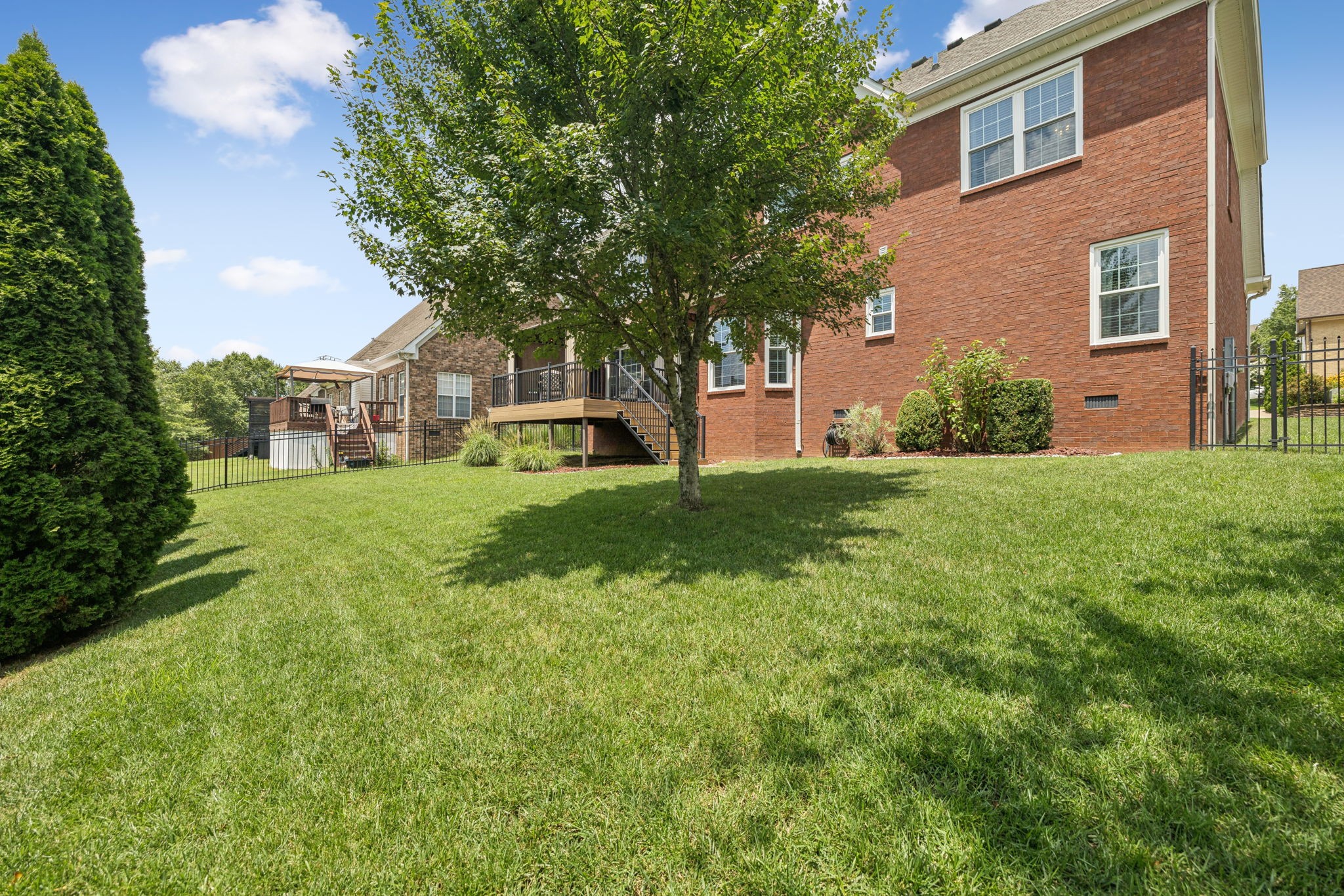 1011 Red Pepper Ridge Spring Hill, TN 37174 - Photo 66 of 76 a view of a house with a yard