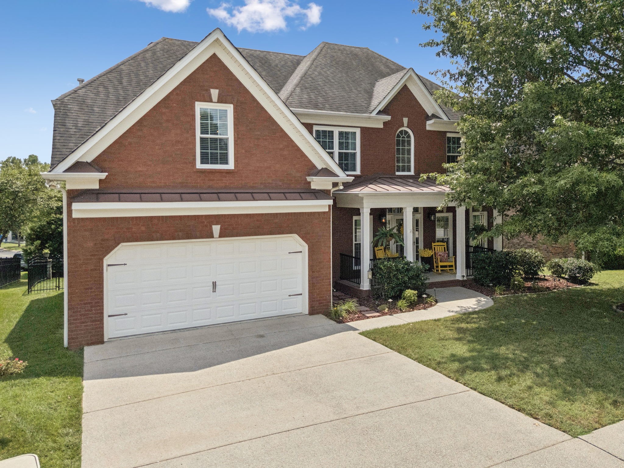 1011 Red Pepper Ridge Spring Hill, TN 37174 - Photo 68 of 76 a front view of a house with a yard